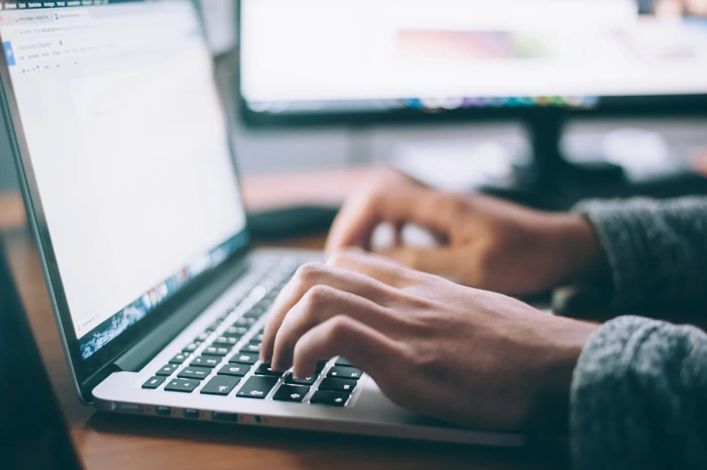 A professional working through a written plan at a desk